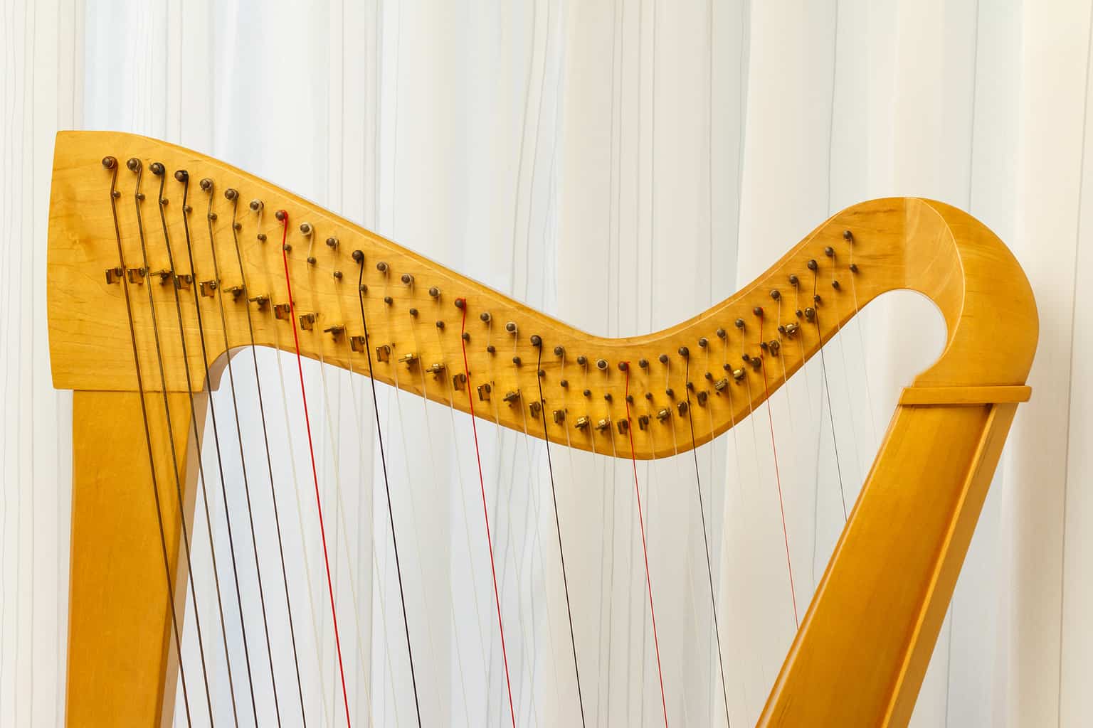 Top part of a celtic harp instrument.